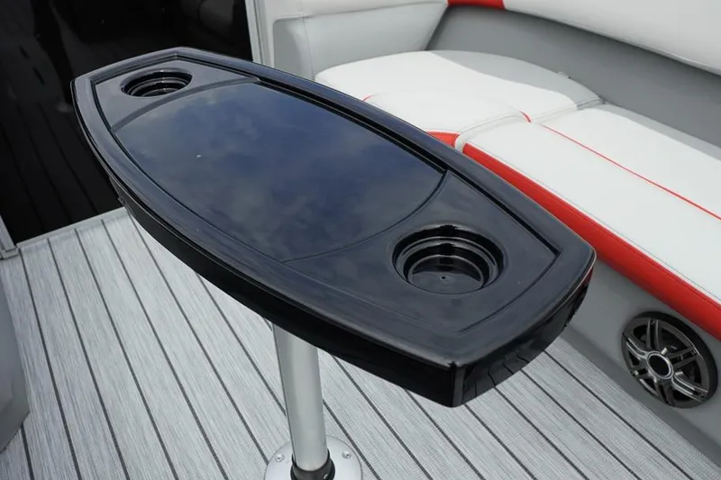 Slide: The Image of Luxury boat interior with sleek black table and cushioned seating, SunCatcher Select 322SL 2026. - 13