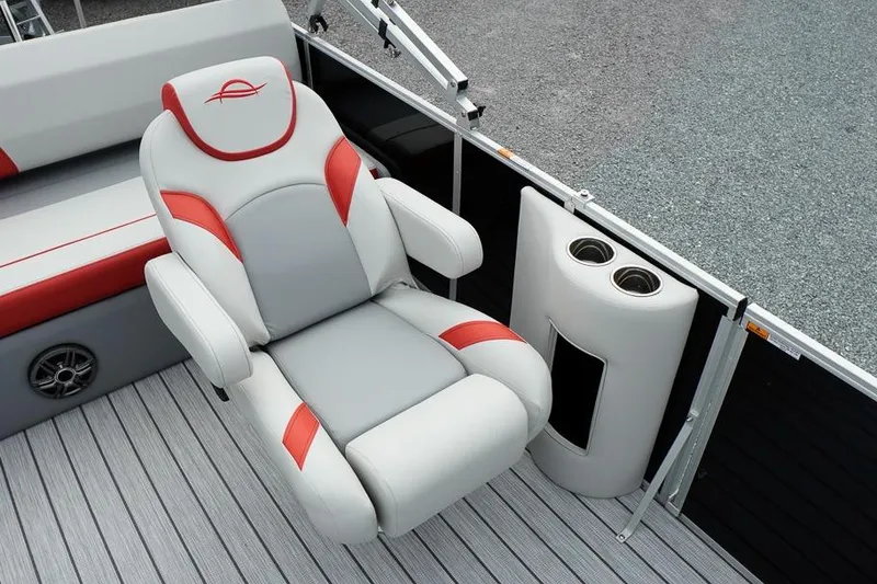 Slide: The Image of 2026 SunCatcher Select 322SL boat seat with red accents and cup holders. - 18