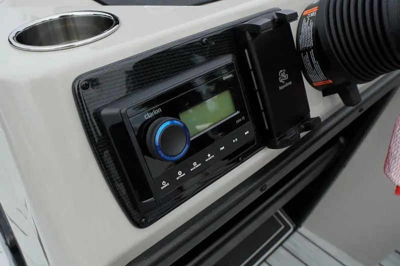 Slide: The Image of Close-up of a 2026 SunCatcher Select 322SL boat dashboard with audio controls. - 27