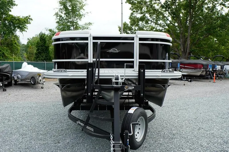 Slide: The Image of 2026 SunCatcher Select 322SL pontoon boat on trailer in outdoor lot. - 3