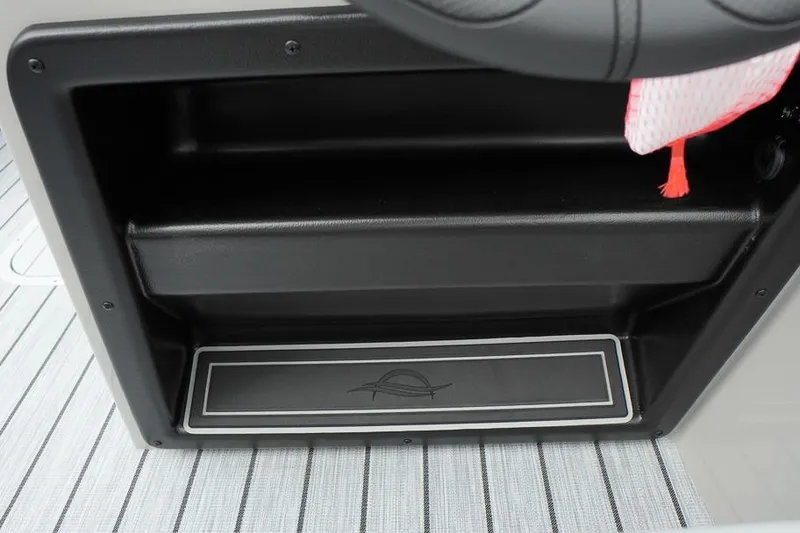 Slide: The Image of Storage compartment in 2026 SunCatcher Select 322SL boat, featuring sleek black design and striped flooring. - 30