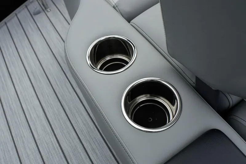 Slide: The Image of Cup holders on SunCatcher Select 322SL boat, 2026 model, with sleek gray interior. - 33