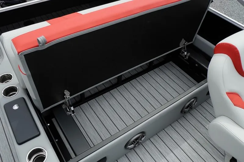 Slide: The Image of Open storage compartment in 2026 SunCatcher Select 322SL boat with cup holders and seating. - 35