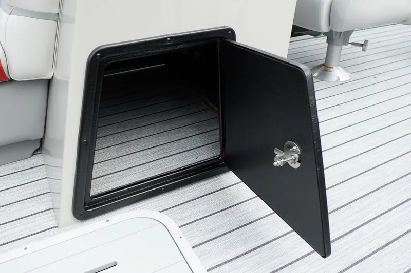 Slide: The Image of Open storage compartment on 2026 SunCatcher Select 322SL boat with striped flooring. - 38