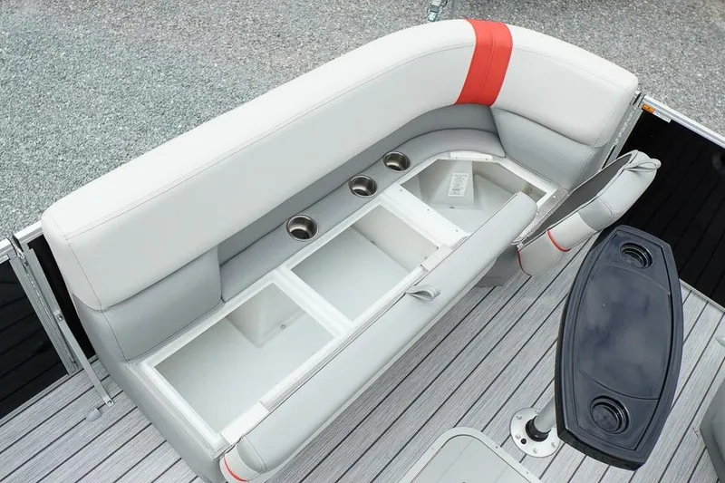 Slide: The Image of 2026 SunCatcher Select 322SL boat seating with storage compartments and cup holders. - 39