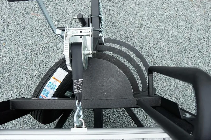 Slide: The Image of Top view of a SunCatcher Select 322SL trailer hitch mechanism, 2026 model, on gravel surface. - 43