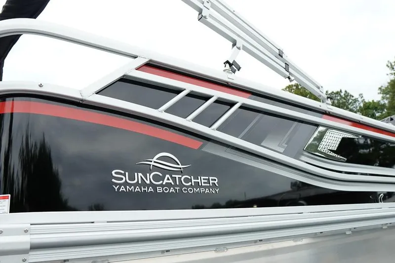 Slide: The Image of 2026 SunCatcher Select 322SL boat by Yamaha, featuring sleek design and branding. - 48