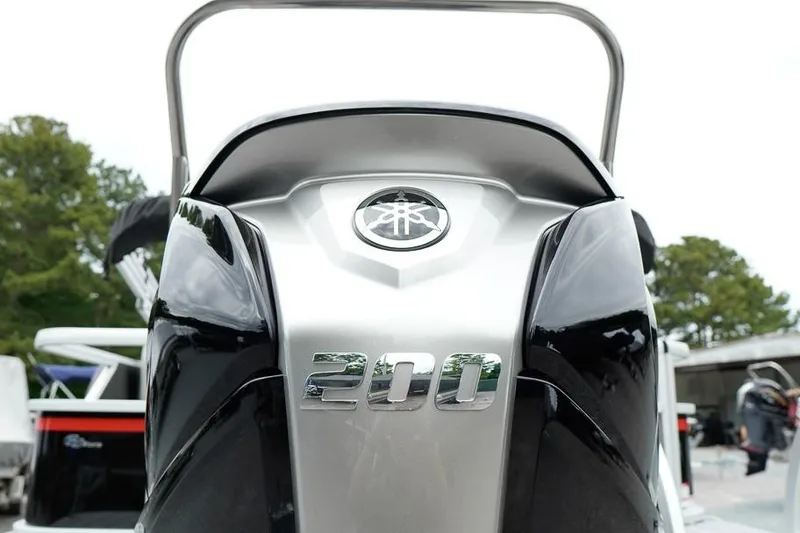 Slide: The Image of Close-up of a 2026 SunCatcher Select 322SL boat engine with "200" emblem. - 7