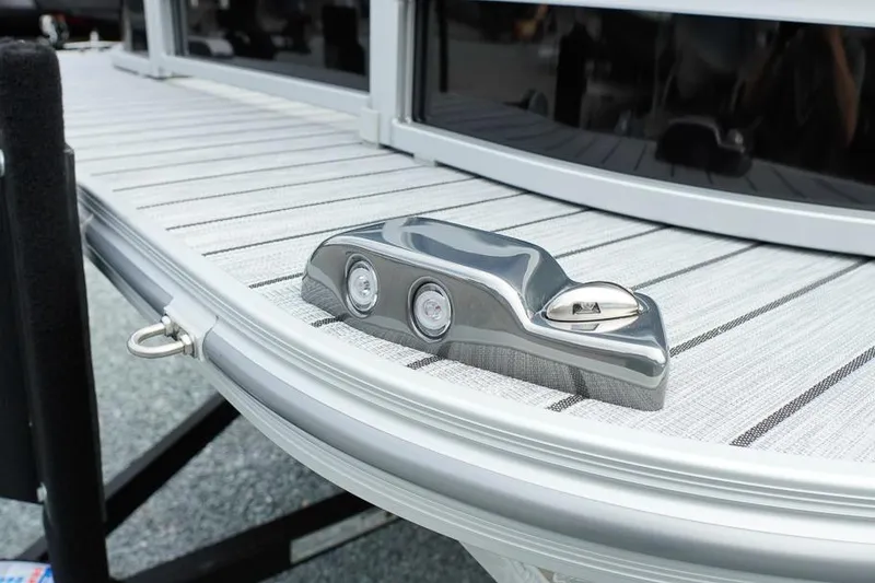 Slide: The Image of 2026 SunCatcher Select 322SL boat deck with sleek metallic cleat and modern design. - 8