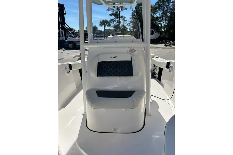 Slide: The Image of 2023 Tidewater 220 LXF boat interior with cushioned seating and sleek design. - 10