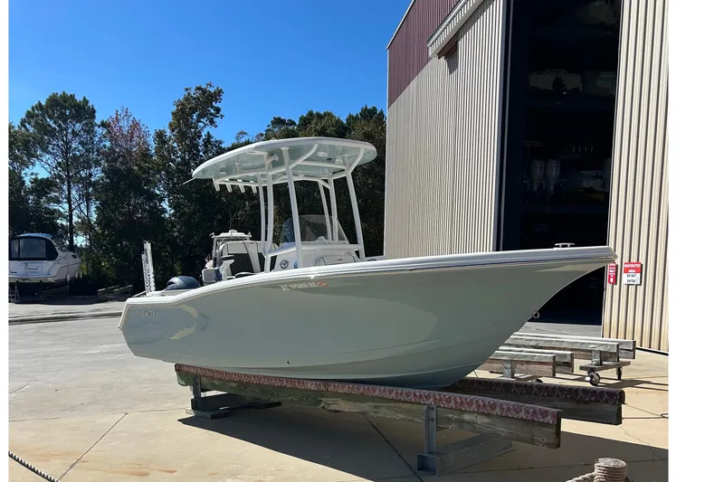 Slide: The Image of 2023 Tidewater 220 LXF boat on trailer outside storage facility. - 4