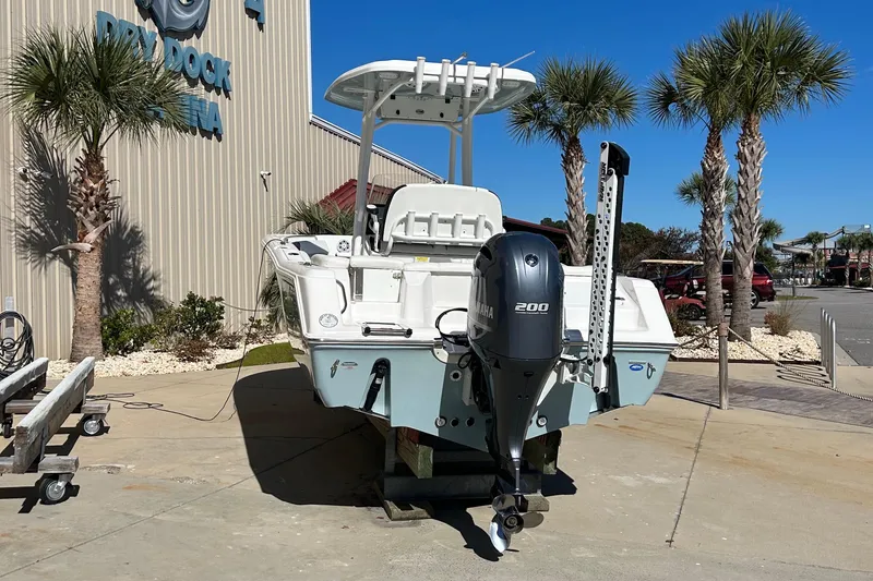 Slide: The Image of 2023 Tidewater 220 LXF boat with Yamaha engine at marina, sunny day. - 6