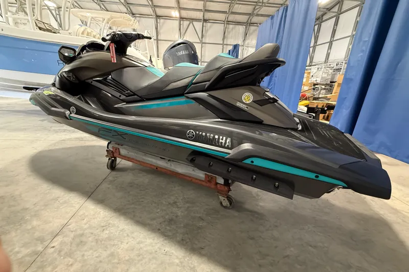 The Image of 2023 Yamaha WaveRunner FX Cruiser HO in a showroom, showcasing sleek design and modern features. - 3