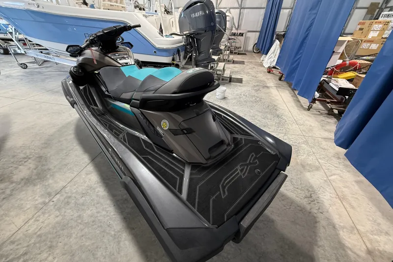Slide: The Image of 2023 Yamaha WaveRunner FX Cruiser HO in a showroom, showcasing sleek design and features. - 5