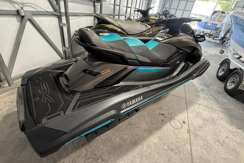 Slide: The Image of 2023 Yamaha WaveRunner FX Cruiser HO in a garage setting. - 6