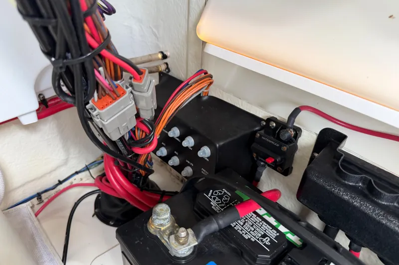 Slide: The Image of Electrical wiring and components inside a 2023 Tidewater 198 CC Adventure boat. - 100