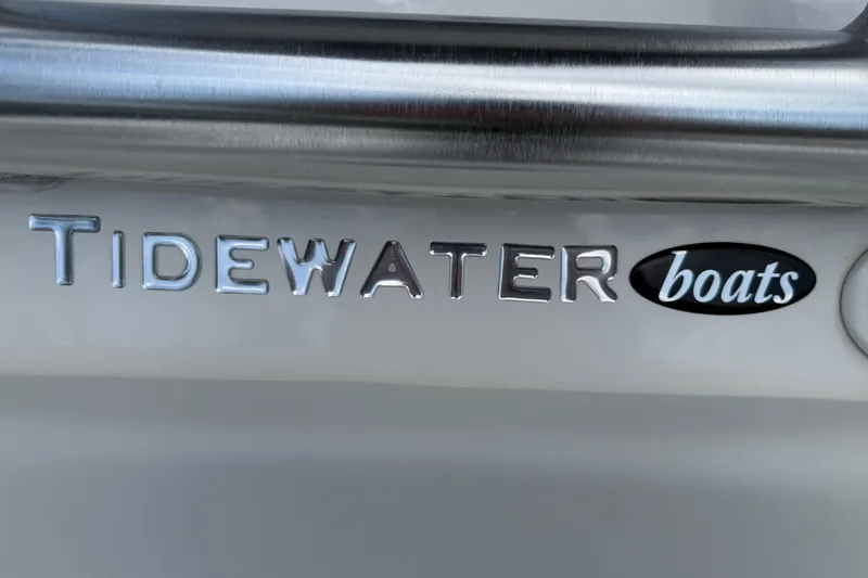Slide: The Image of 2023 Tidewater 198 CC Adventure boat logo with metallic lettering. - 104