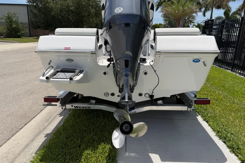 Slide: The Image of 2023 Tidewater 198 CC Adventure boat on trailer, rear view with outboard motor. - 12