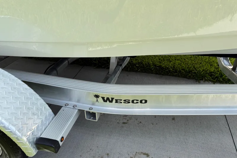 Slide: The Image of Trailer for 2023 Tidewater 198 CC Adventure boat by Wesco on pavement. - 16