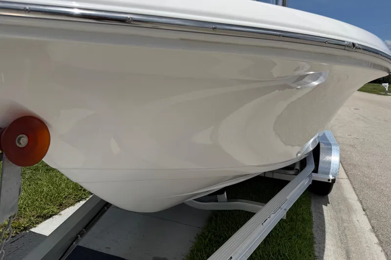 Slide: The Image of 2023 Tidewater 198 CC Adventure boat on trailer, side view. - 23
