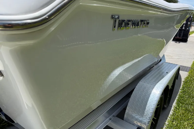 Slide: The Image of 2023 Tidewater 198 CC Adventure boat on trailer, showcasing sleek design and branding. - 27