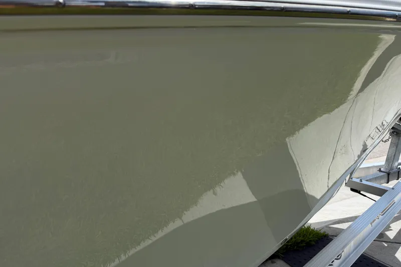 Slide: The Image of 2023 Tidewater 198 CC Adventure boat hull on trailer, showcasing sleek design. - 29
