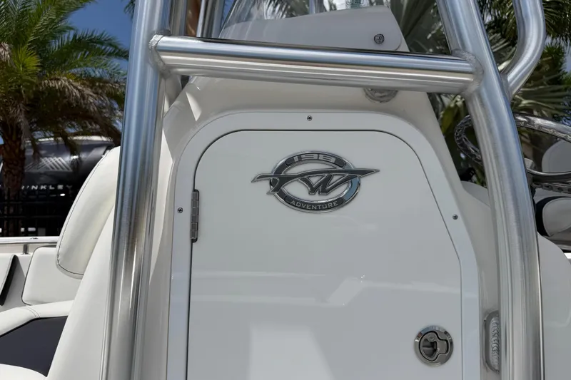 Slide: The Image of 2023 Tidewater 198 CC Adventure boat console with logo, featuring sleek design and stainless steel accents. - 32