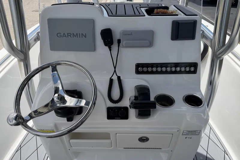 Slide: The Image of 2023 Tidewater 198 CC Adventure boat console with Garmin navigation and steering wheel. - 33