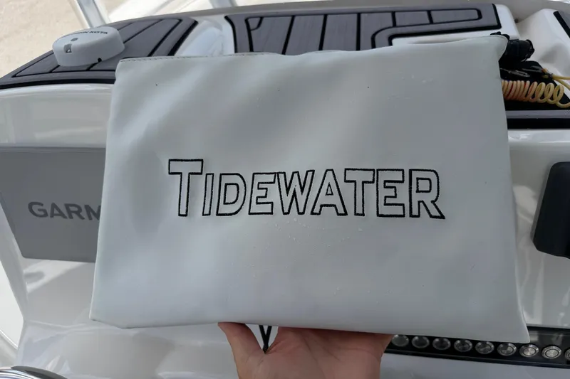 Slide: The Image of White Tidewater bag on a 2023 Tidewater 198 CC Adventure boat dashboard. - 44