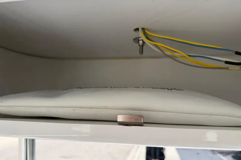 Slide: The Image of Storage compartment with wiring in 2023 Tidewater 198 CC Adventure boat. - 45