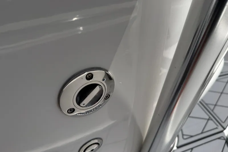 Slide: The Image of 2023 Tidewater 198 CC Adventure boat water inlet detail with chrome finish. - 48