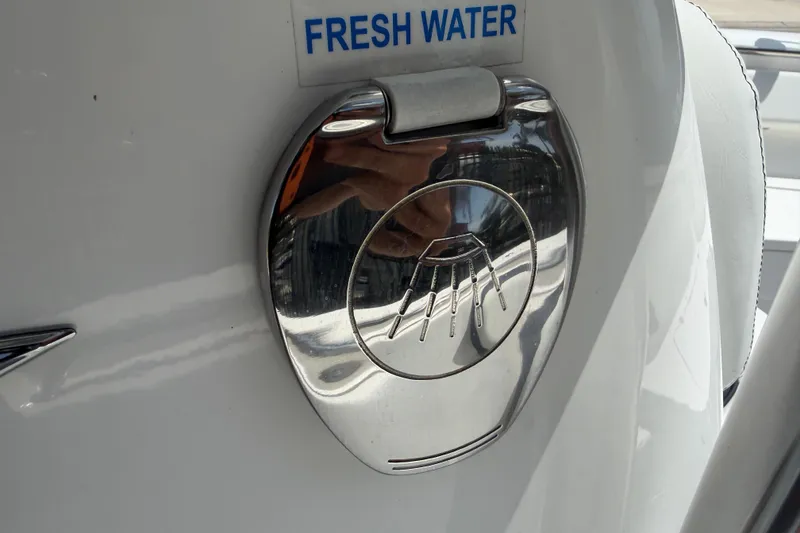 Slide: The Image of 2023 Tidewater 198 CC Adventure boat fresh water access port. - 49