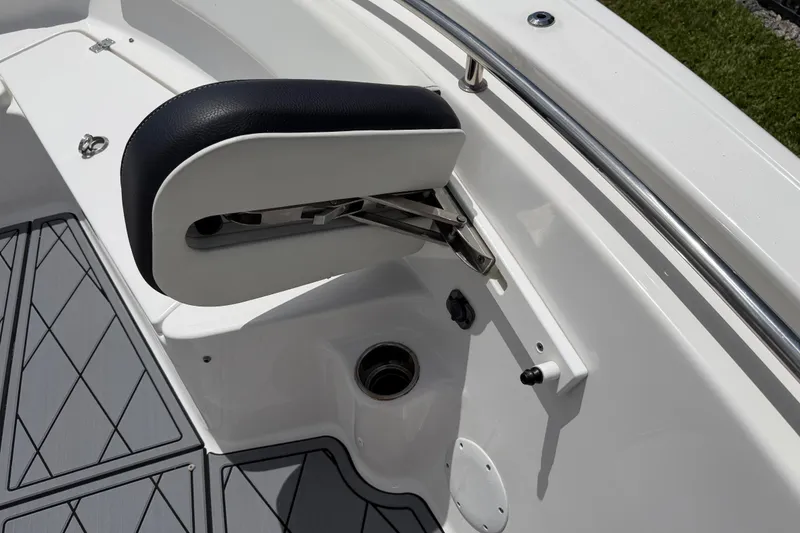 Slide: The Image of 2023 Tidewater 198 CC Adventure boat interior with cushioned seating and stainless steel railing. - 52
