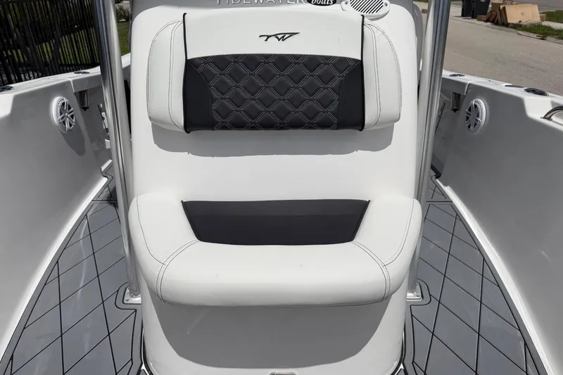 Slide: The Image of 2023 Tidewater 198 CC Adventure boat interior with cushioned seating and sleek design. - 53