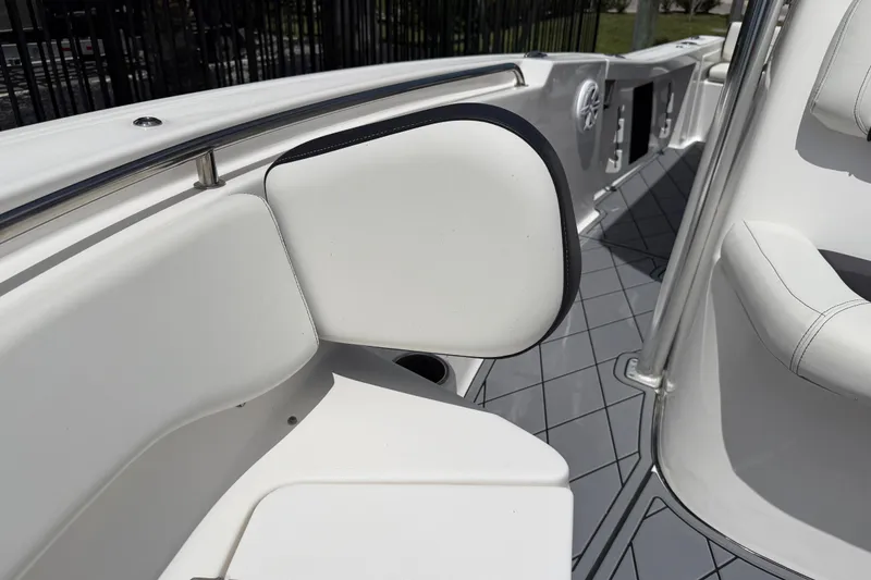 Slide: The Image of 2023 Tidewater 198 CC Adventure boat interior with cushioned seating and sleek design. - 57