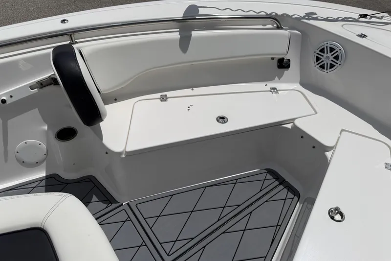 Slide: The Image of 2023 Tidewater 198 CC Adventure boat interior with seating and speaker detail. - 58