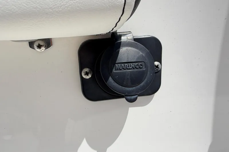 Slide: The Image of Close-up of Marinco power outlet on 2023 Tidewater 198 CC Adventure boat. - 61
