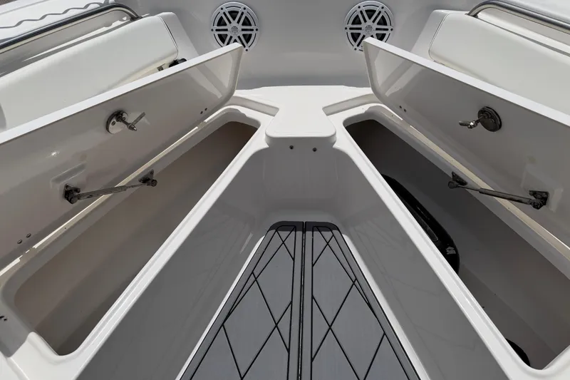 Slide: The Image of 2023 Tidewater 198 CC Adventure boat storage compartments open, showcasing spacious interior. - 62