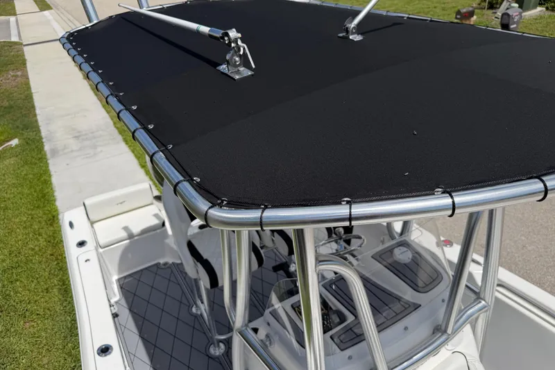 Slide: The Image of 2023 Tidewater 198 CC Adventure boat with T-top and seating, viewed from above. - 70