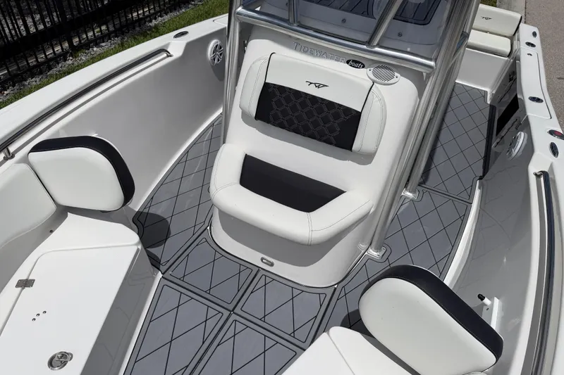 Slide: The Image of 2023 Tidewater 198 CC Adventure boat interior with cushioned seating and sleek design. - 71
