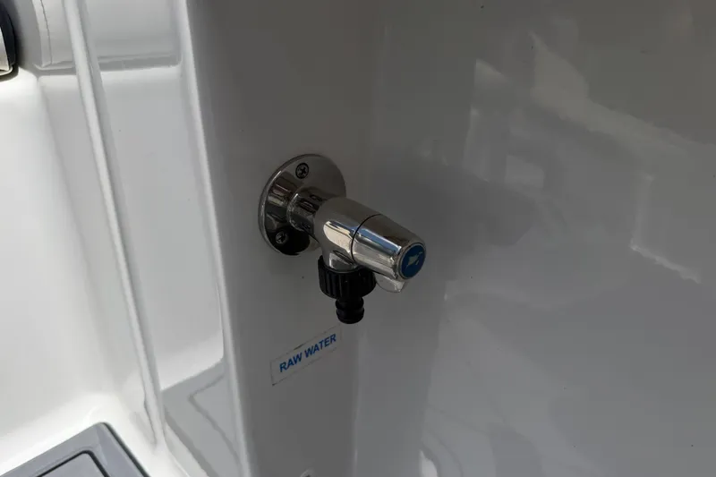 Slide: The Image of 2023 Tidewater 198 CC Adventure raw water outlet on boat interior. - 76