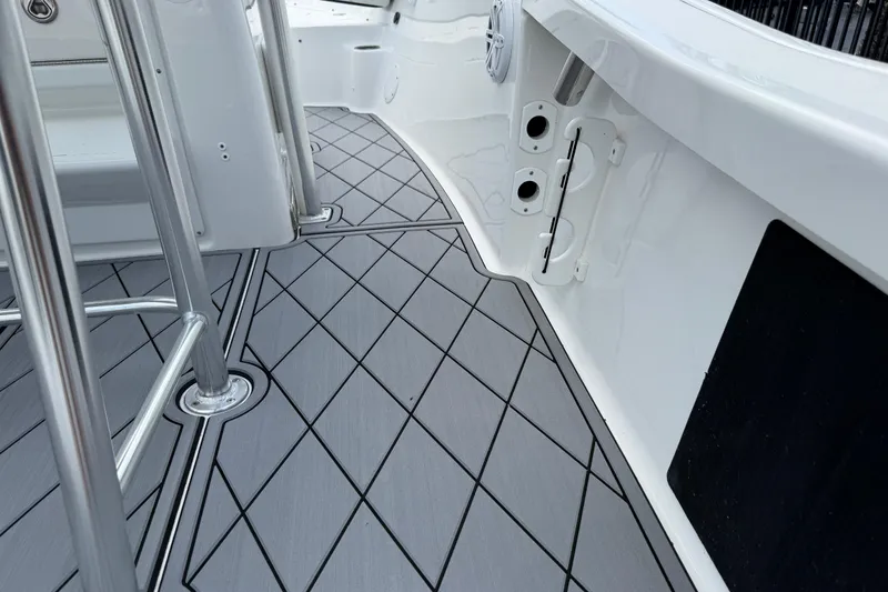 Slide: The Image of 2023 Tidewater 198 CC Adventure boat deck with sleek, modern design and durable flooring. - 82