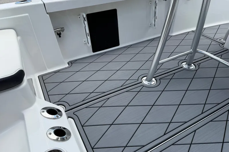 Slide: The Image of 2023 Tidewater 198 CC Adventure boat deck with sleek, modern design and stainless steel fittings. - 86