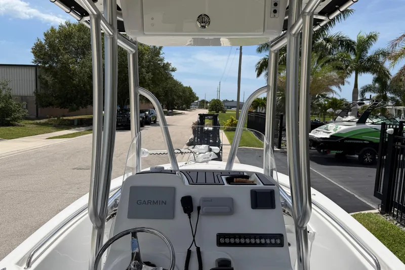 Slide: The Image of 2023 Tidewater 198 CC Adventure boat dashboard with Garmin navigation system. - 89
