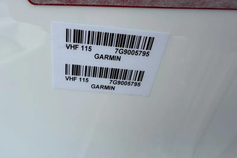 Slide: The Image of Barcode labels on 2023 Tidewater 198 CC Adventure boat, featuring Garmin VHF 115. - 92