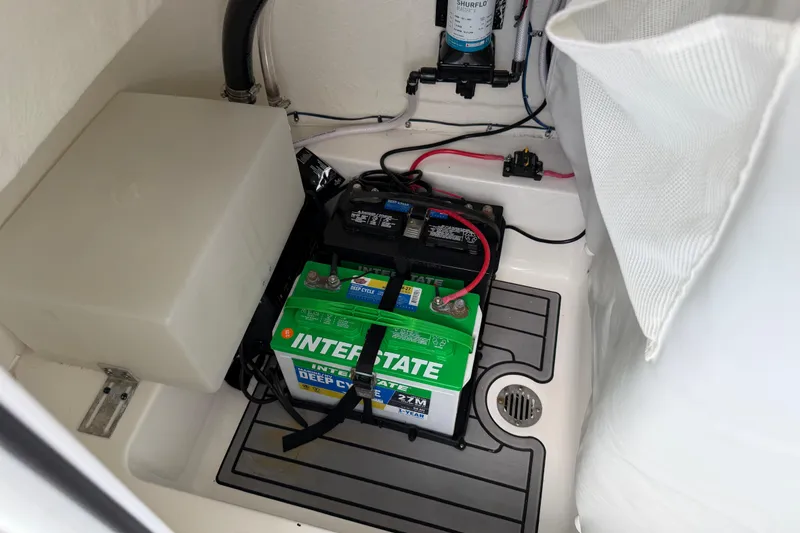 Slide: The Image of Battery compartment of 2023 Tidewater 198 CC Adventure boat with Interstate deep cycle battery. - 93