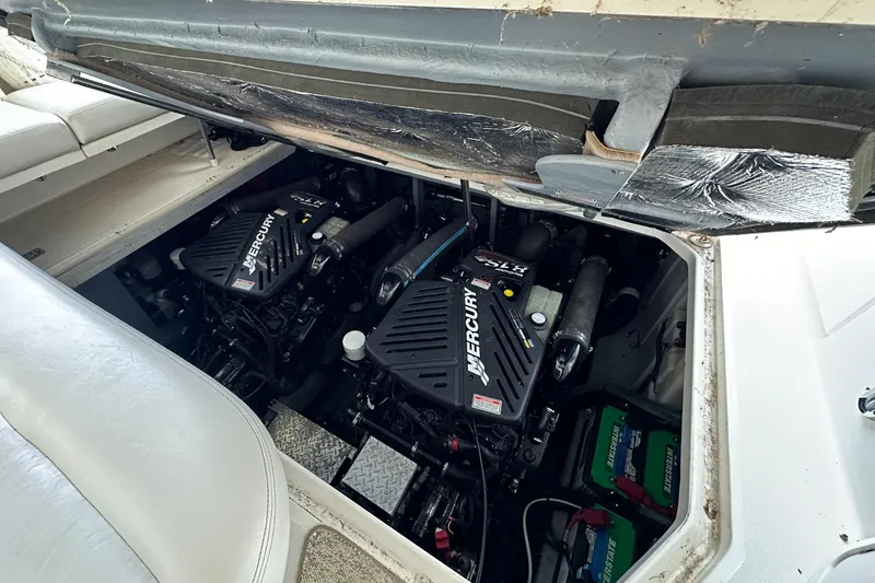 Slide: The Image of Engine compartment of a 2001 Sea Ray 410 Sundancer with twin Mercury engines. - 11
