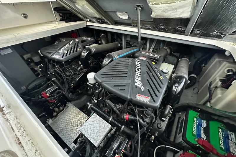 Slide: The Image of Engine compartment of a 2001 Sea Ray 410 Sundancer with twin Mercury engines. - 12