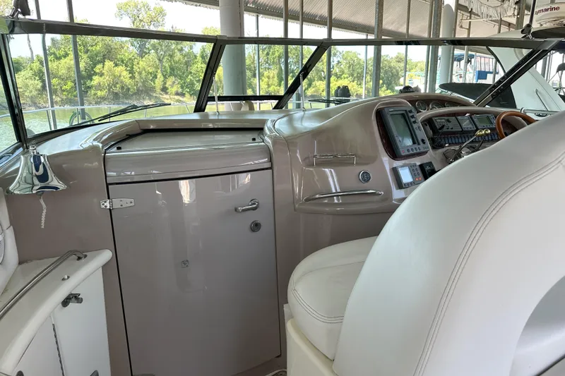 Slide: The Image of Interior helm of 2001 Sea Ray 410 Sundancer yacht with navigation equipment. - 14