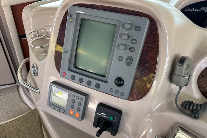 Slide: The Image of Control panel of a 2001 Sea Ray 410 Sundancer boat with navigation equipment. - 21